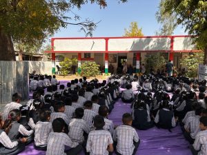 Students of Bobha Primary School gathered in shade for morning assembly 